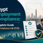Cover image for Egypt Employment Compliance guide, featuring bold title text, Cairo skyline, a compliance checklist, a shield icon, and two business professionals reviewing a tablet.